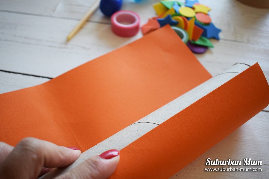Wrapping colour card around empty kitchen roll tube