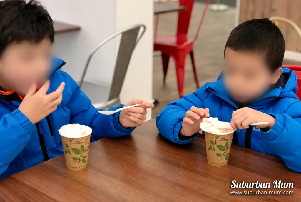 Children enjoying hot chocolate at Hampton Court Palace Ice Rink