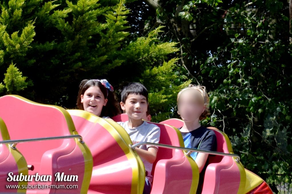 Children riding the Clown Coaster at Wicksteed Park