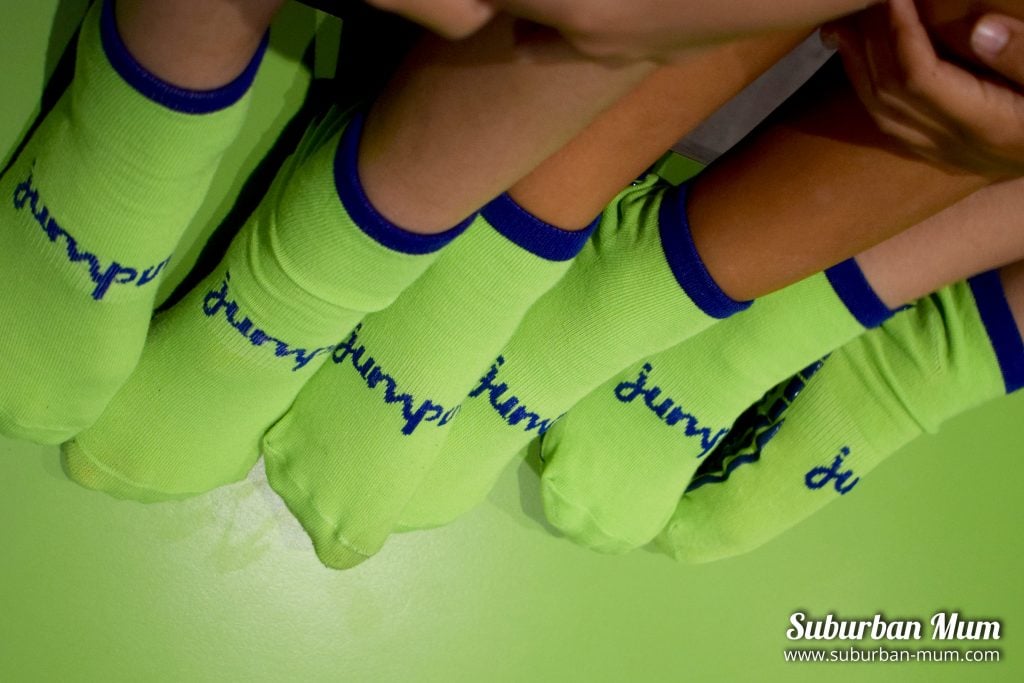 Children wearing green Jump In Trampoline socks