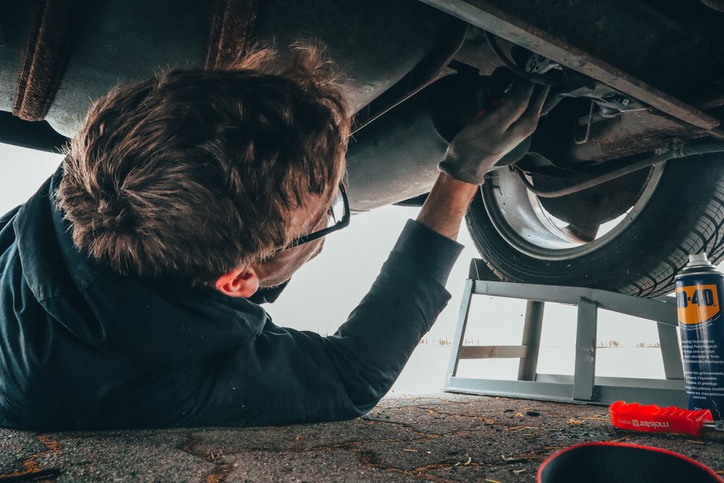 man-fixing-vehicle-engine