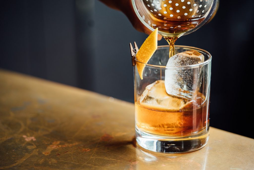 Whisky pouring from a cocktail shaker
