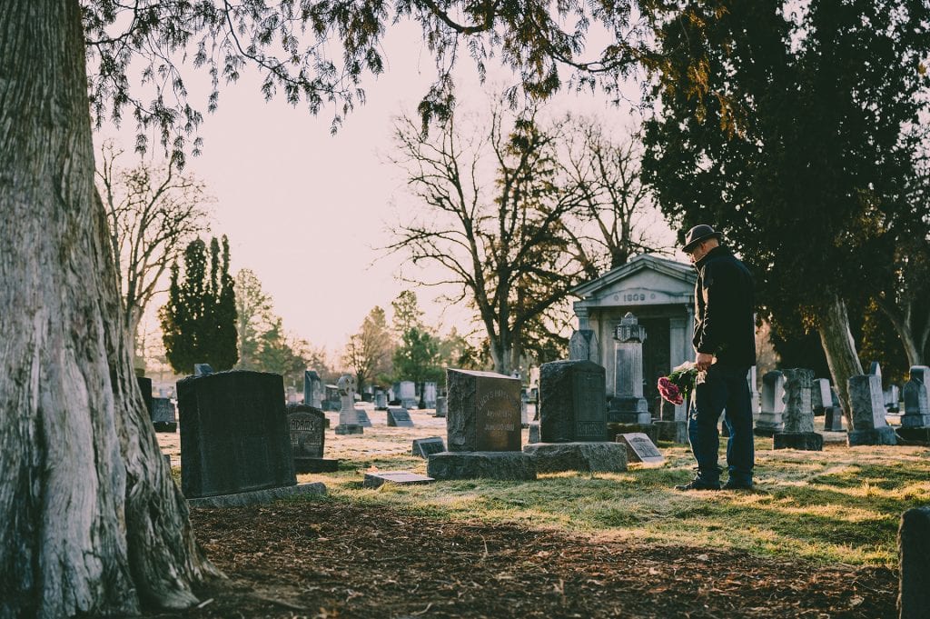 visiting-cemetery-with-flowers