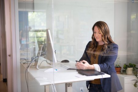 9deab7f6 woman in front of sit to stand desk