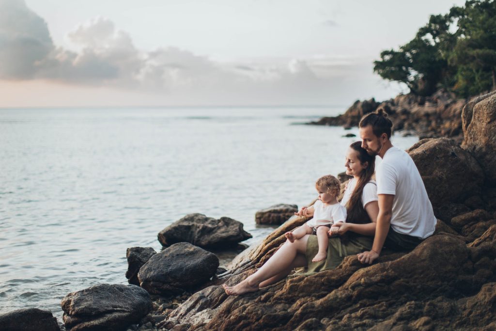 family sat beside the beech