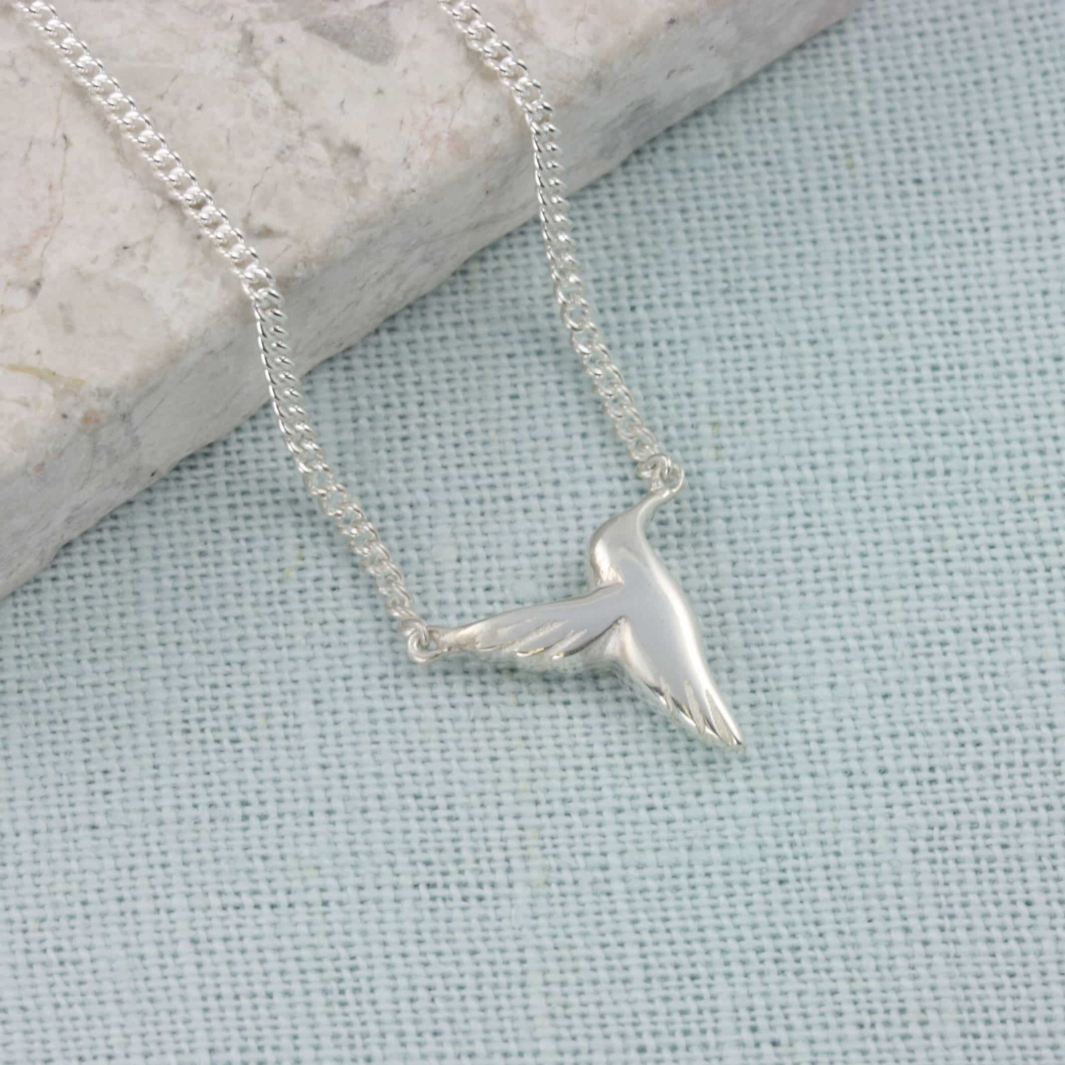 small hummingbird necklace closeup