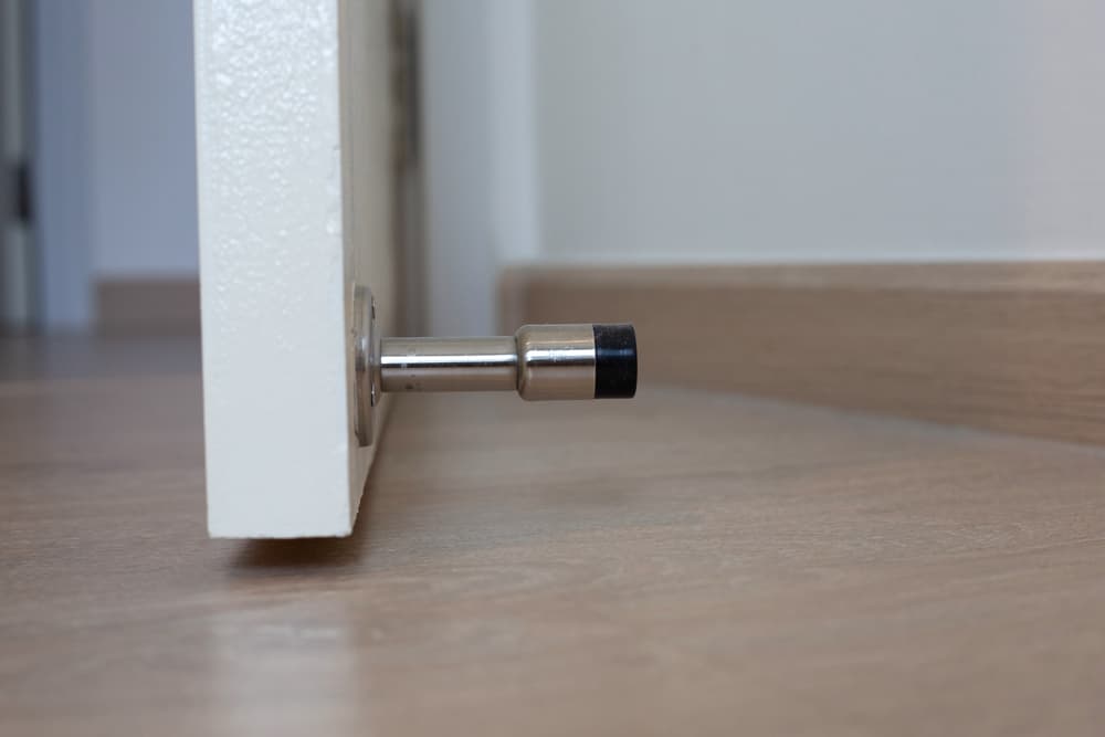 white door with door stopper