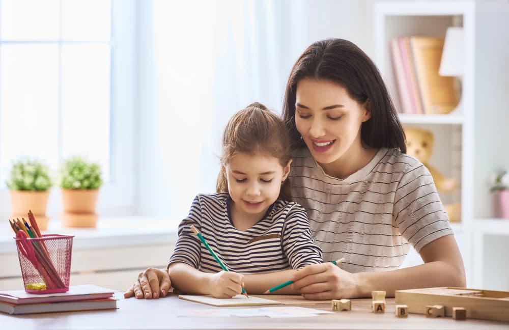 child reading with parent