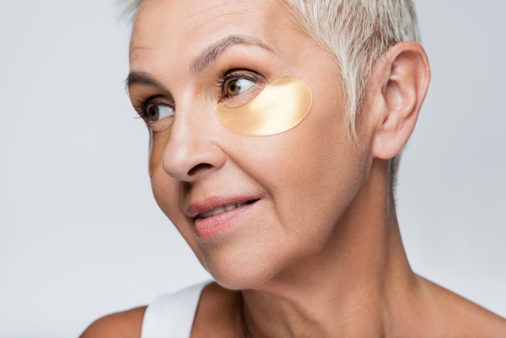 woman with collagen eye patch