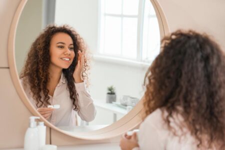 woman putting contacts in