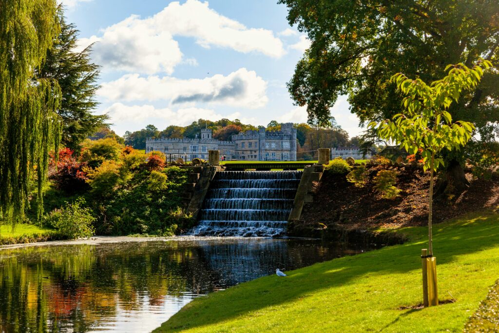 a view of leeds castle taking in the waterfall steps