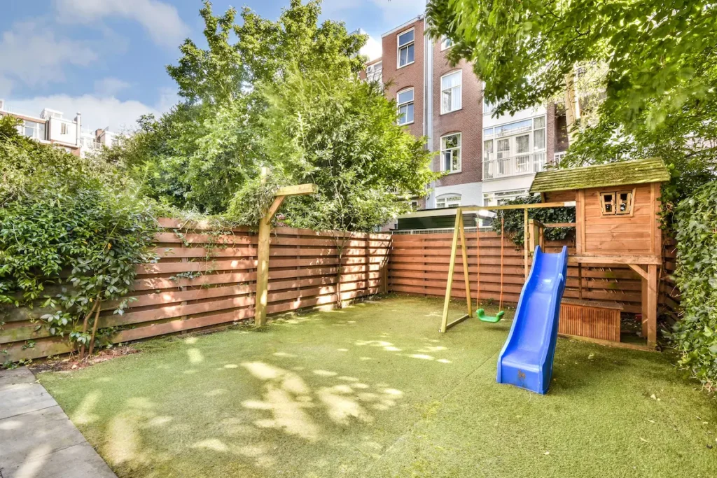 Family garden with play area and seating space after outdoor renovation