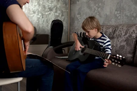 child learning musical instrument