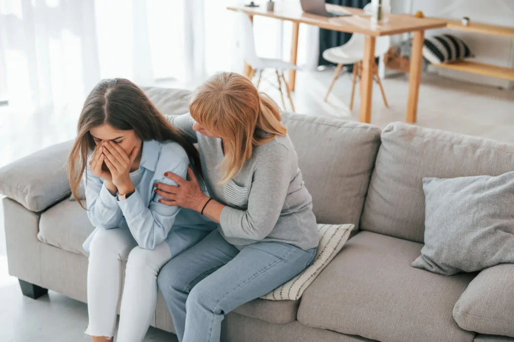 Woman comforting a loved one experiencing mental health challenges