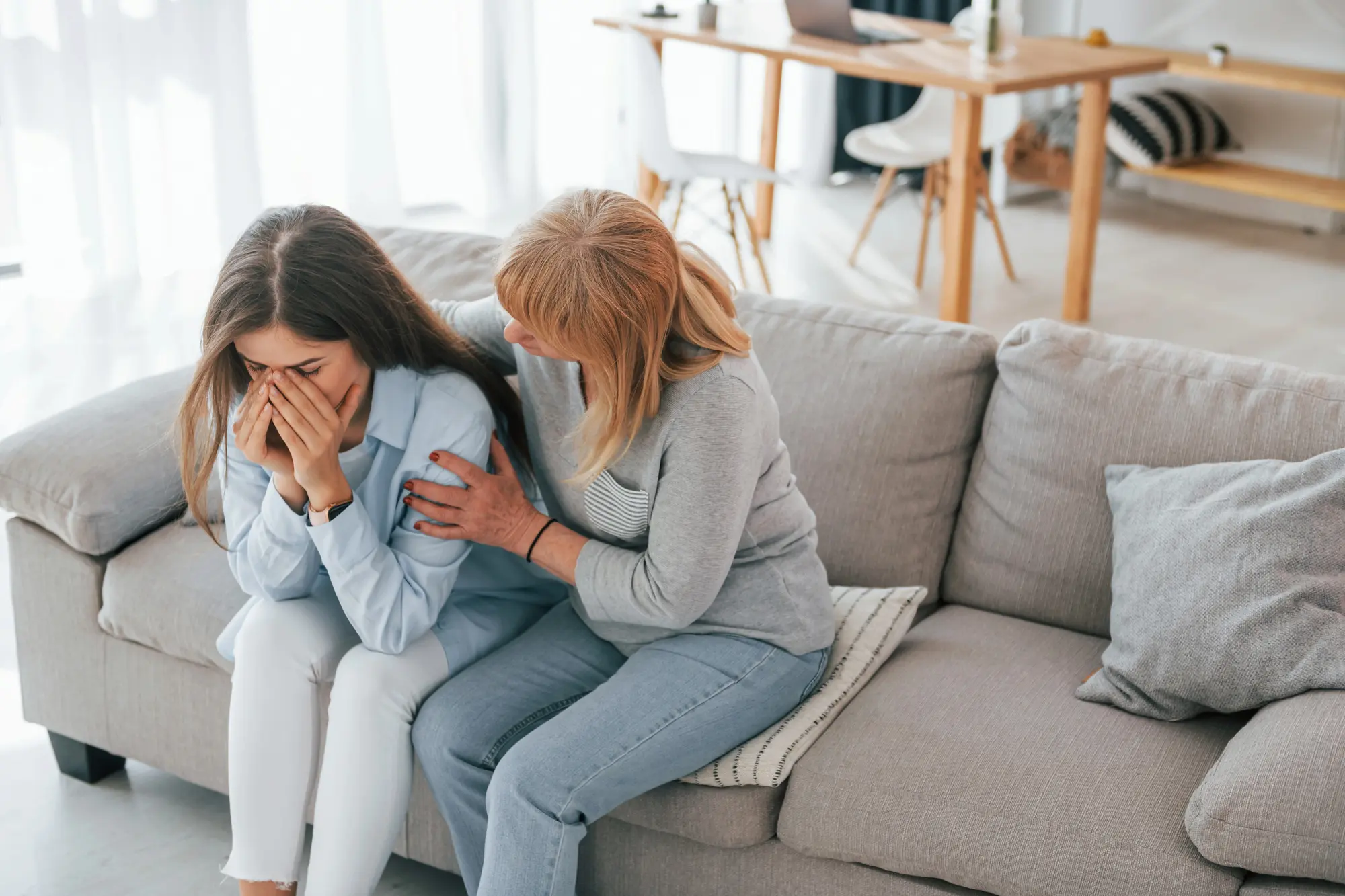 Woman comforting a loved one experiencing mental health challenges
